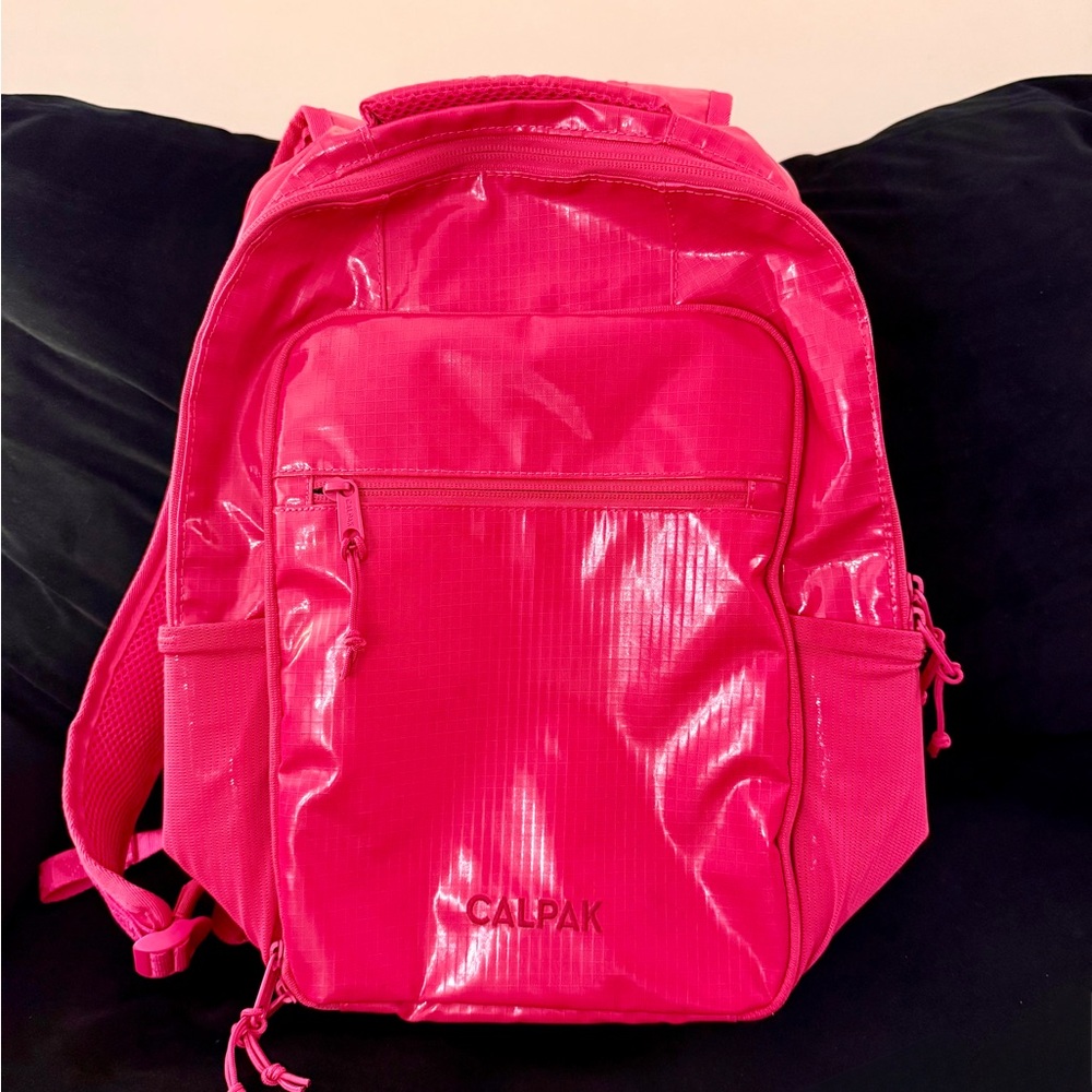 Calpak Pink Glossy Backpack Functional and Eye-Catching